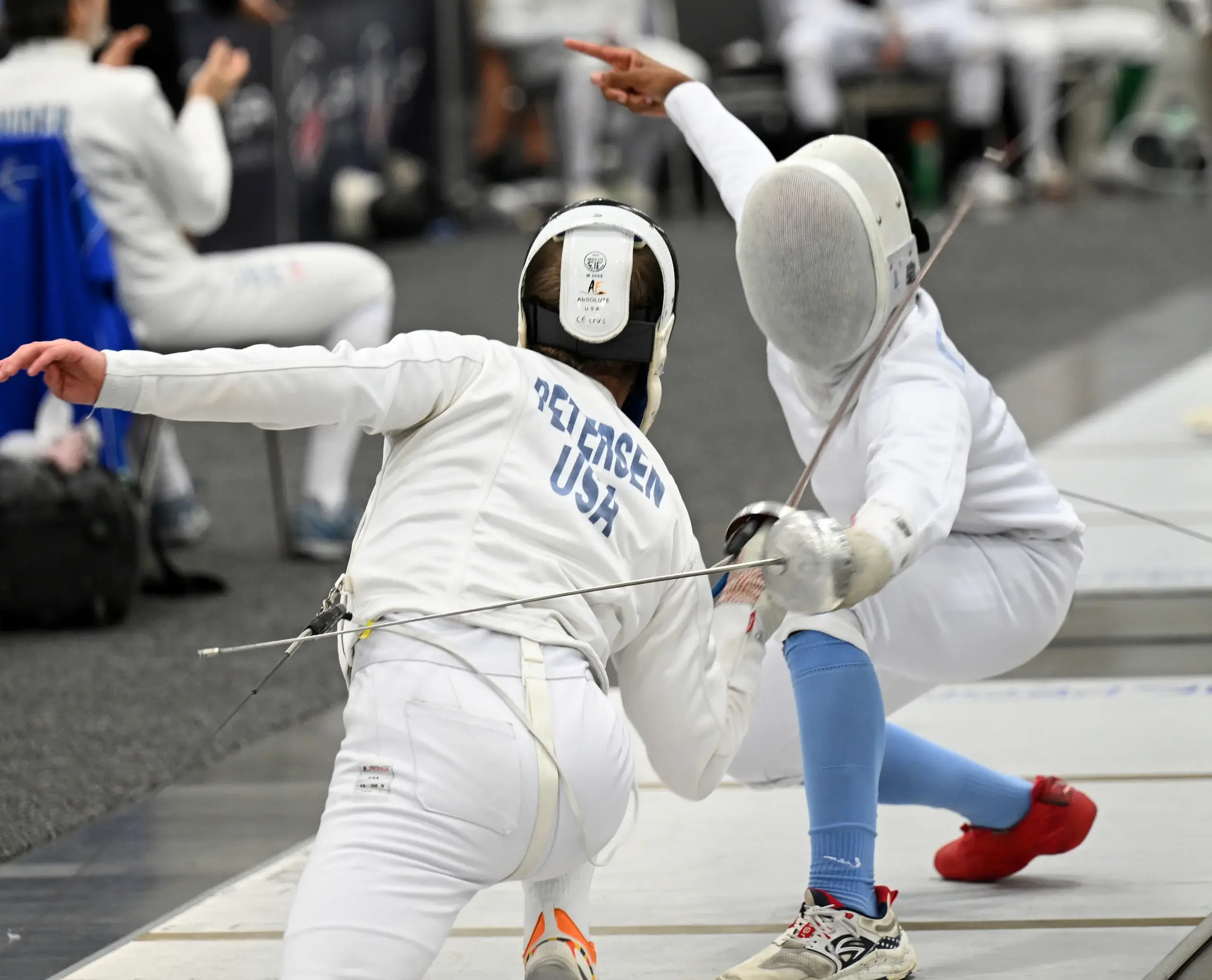 A coach giving a private fencing lesson at Metro Tacoma Fencing Club
